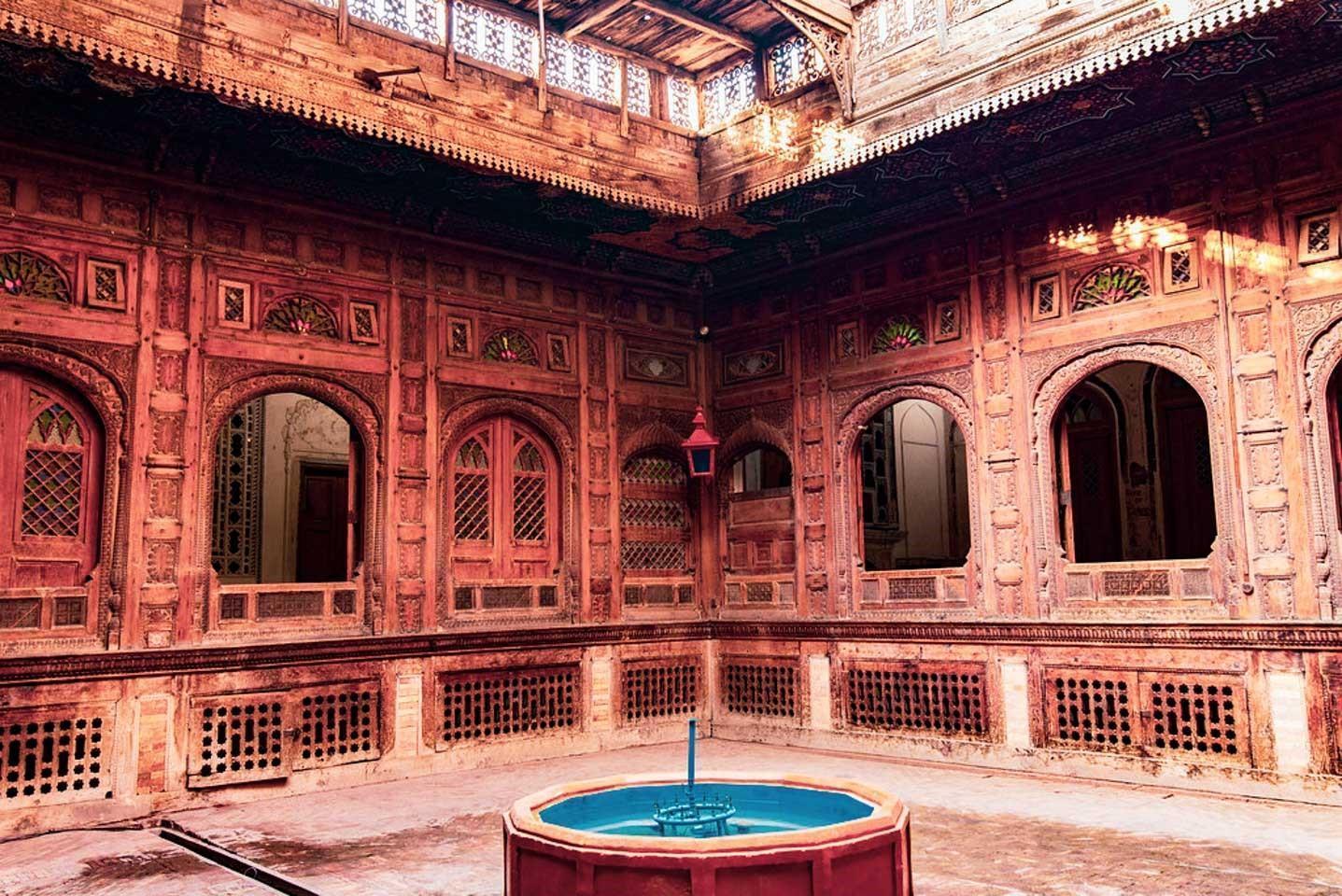 Interior courtyard and traditional woodwork inside Sethi House Museum, Peshawar